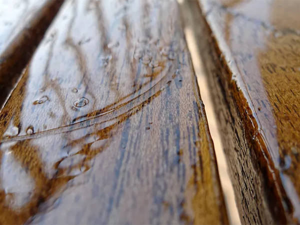 when water soaks into wood floor